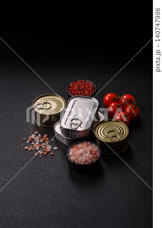 A metal tin can of meat, fish, or dog or cat food. A tin can of food A metal tin can of meat, fish, or dog or cat food. A tin can of food 140747986