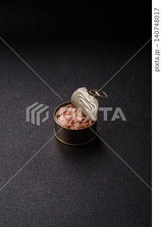 Fish, canned tuna chunks in brine for sandwiches and salads. Canned tuna Fish, canned tuna chunks in brine for sandwiches and salads. Canned tuna 140748017