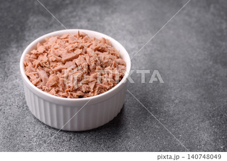 Fish, canned tuna chunks in brine for sandwiches and salads. Canned tuna 140748049