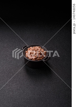 Fish, canned tuna chunks in brine for sandwiches and salads. Canned tuna Fish, canned tuna chunks in brine for sandwiches and salads. Canned tuna 140748056
