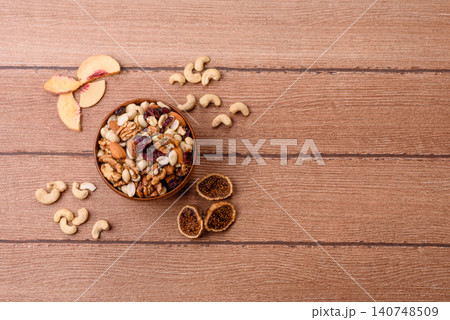 A mix of pistachios, hazelnuts, walnuts, peanuts, dried berries, and fruits. A mix of nuts A mix of pistachios, hazelnuts, walnuts, peanuts, dried berries, and fruits. A mix of nuts 140748509