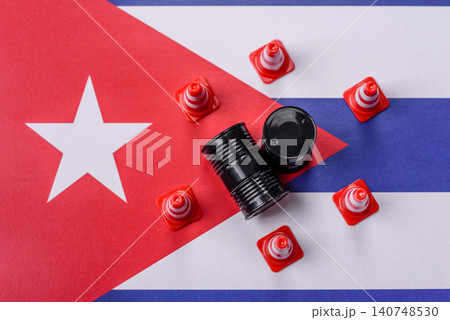 The cargo container ban on the Cuba flag as a conceptual backdrop. The cargo container embargo The cargo container ban on the Cuba flag as a conceptual backdrop. The cargo container embargo 140748530