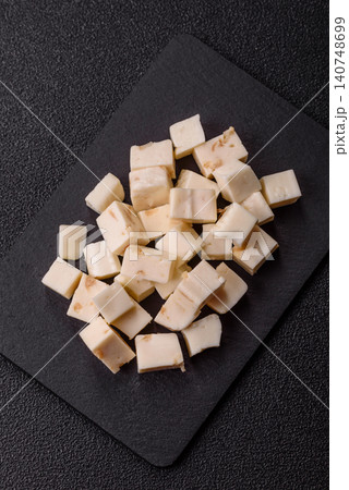White feta, tofu, or mozzarella cheese cubes with herbs. White mozzarella cheese 140748699