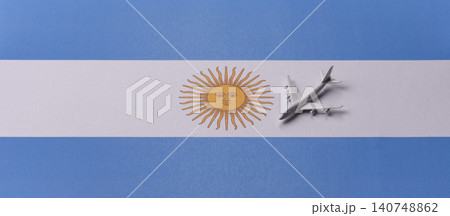 Airplane on the Argentine flag as a conceptual backdrop for flights. Airplane on the Argentine flag Airplane on the Argentine flag as a conceptual backdrop for flights. Airplane on the Argentine flag 140748862