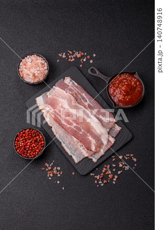 Raw fresh bacon slices with layers of meat or prosciutto with salt and spices. Raw bacon 140748916