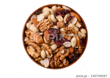 A mix of pistachios, hazelnuts, walnuts, peanuts, dried berries, and fruits. A mix of nuts 140749097