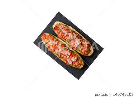 Baked zucchini half with minced meat, tomatoes, cheese, salt, and spices. Zucchini with minced meat Baked zucchini half with minced meat, tomatoes, cheese, salt, and spices. Zucchini with minced meat 140749103