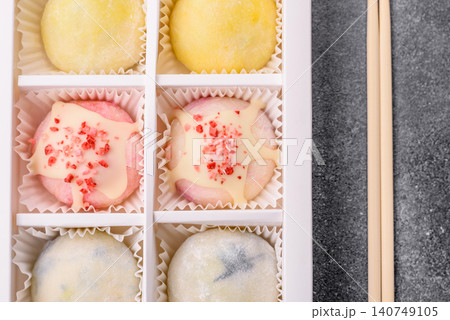 Japanese sweet frozen mochi with rice dough, fruit, and chocolate filling. Japanese mochi Japanese sweet frozen mochi with rice dough, fruit, and chocolate filling. Japanese mochi 140749105