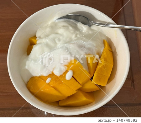 Fresh Mango with Creamy Natural Yogurt in Breakfast Bowl Fresh Mango with Creamy Natural Yogurt in Breakfast Bowl 140749392