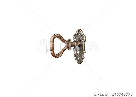 Old shabby key in keyhole on a white background Old shabby key in keyhole on a white background 140749776