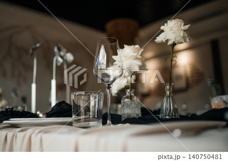 Top view of luxury dark and moody table decor for a fine dining event or reception Top view of luxury dark and moody table decor for a fine dining event or reception 140750481