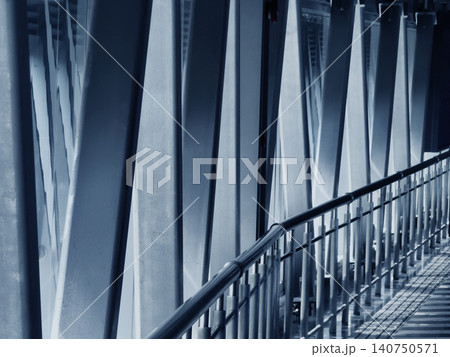 Serene and precise industrial bridge interior illuminated by neon lighting and reflections 140750571