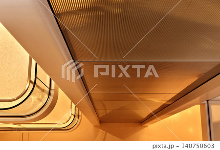 Modern sweeping atrium silhouette showcasing layered reflections and soothing warm ambient lighting 140750603