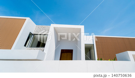 Modern building with open design. Stylish home with geometric and sunlit features Modern building with open design. Stylish home with geometric and sunlit features 140750636