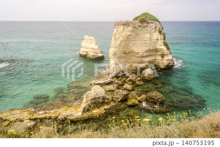 Scenic rocky cliffs of Torre Sant Andrea, Salento, Italy 140753195