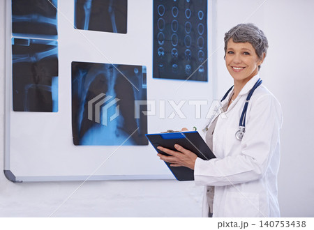 Senior doctor, woman and clipboard in radiology for surgery with anatomy scan and healthcare in portrait. Medical professional, treatment and surgeon in room for xray, medicine and confident expert Senior doctor, woman and clipboard in radiology for surgery with anatomy scan and healthcare in portrait. Medical professional, treatment and surgeon in room for xray, medicine and confident expert 140753438