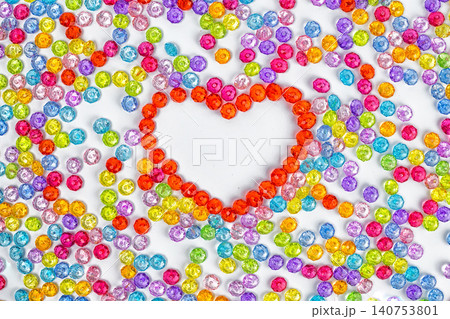 Background heart made of colored acrylic beads. Valentynes day Background heart made of colored acrylic beads. Valentynes day 140753801