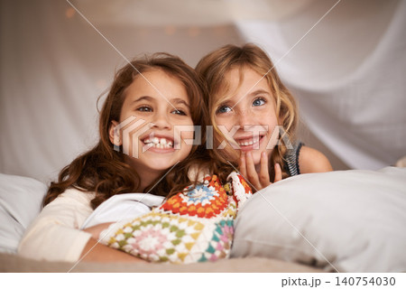 Happy, sleepover and face of children in bedroom for playing, bonding and relax with toys in home. Laughing, friends and young girls on bed in tent or blanket fort for childhood, fun and happiness Happy, sleepover and face of children in bedroom for playing, bonding and relax with toys in home. Laughing, friends and young girls on bed in tent or blanket fort for childhood, fun and happiness 140754030