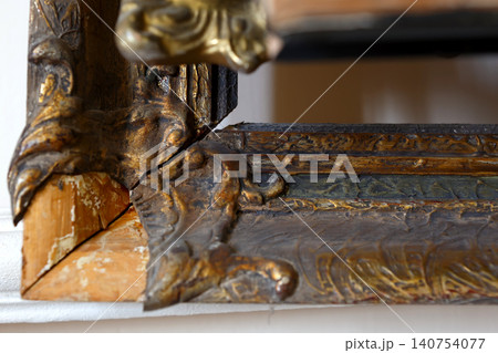 Carved Wood Detail Showing Craftsmanship and Design in a Workshop Setting During Daytime Carved Wood Detail Showing Craftsmanship and Design in a Workshop Setting During Daytime 140754077