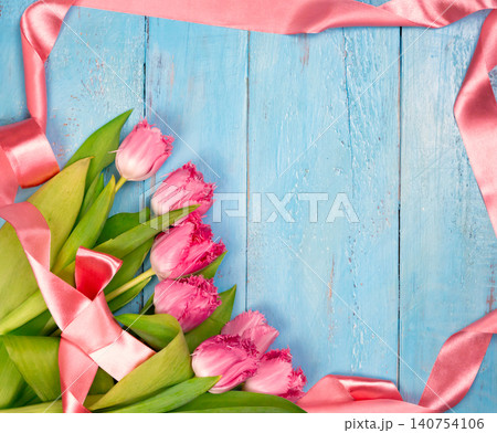Bouquet of tulips on blue wooden table. Happy women's day. 8 March., Mother's Day. Flat lay and copy space 140754106