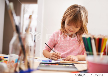 Happy child, writing and drawing with color for creativity, learning or education at home. Young girl with color pencil for sketching, activity or artwork in early childhood development at the house Happy child, writing and drawing with color for creativity, learning or education at home. Young girl with color pencil for sketching, activity or artwork in early childhood development at the house 140754318