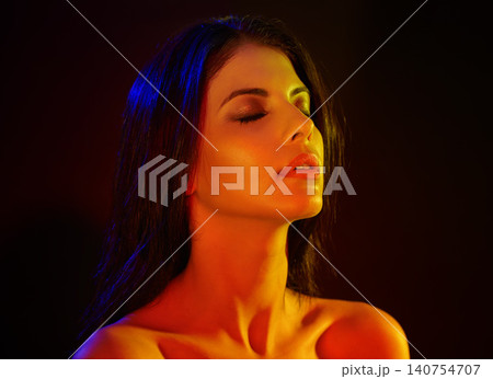 Studio, model or beauty in artistic lighting with eyes closed, shadow or silhouette of hand on black background. Woman, cosmetic and creative aesthetic for art deco and makeup for skincare or facial Studio, model or beauty in artistic lighting with eyes closed, shadow or silhouette of hand on black background. Woman, cosmetic and creative aesthetic for art deco and makeup for skincare or facial 140754707