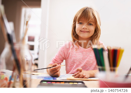 Happy child, portrait and drawing with color for creativity, learning or education at home. Young girl with paintbrush for sketching, writing or artwork in early childhood development at the house Happy child, portrait and drawing with color for creativity, learning or education at home. Young girl with paintbrush for sketching, writing or artwork in early childhood development at the house 140754726