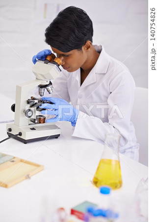Doctor, microscope and scientist in laboratory for equipment, experiment and innovation. Science, technology and researcher or woman with medical research for sample analysis and bacteria testing 140754826