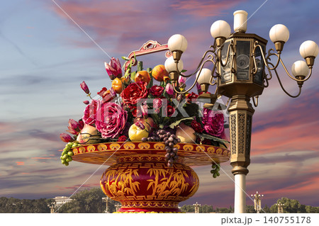 Street lamp and huge flower basket (against the sunset) in Tiananmen square, Beijing, China Street lamp and huge flower basket (against the sunset) in Tiananmen square, Beijing, China 140755178