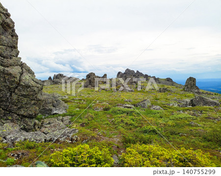 Mountain landscape with grass and stones. 140755299