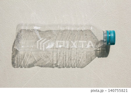 It is an empty plastic bottle. It is an empty plastic bottle. 140755821
