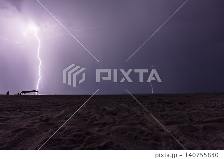 night shooting of a thunderstorm over the sea, photography of lightning night shooting of a thunderstorm over the sea, photography of lightning 140755830