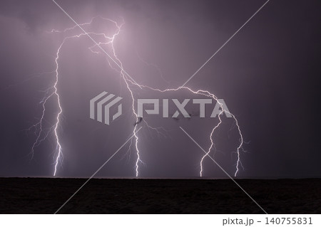 night shooting of a thunderstorm over the sea, photography of lightning 140755831