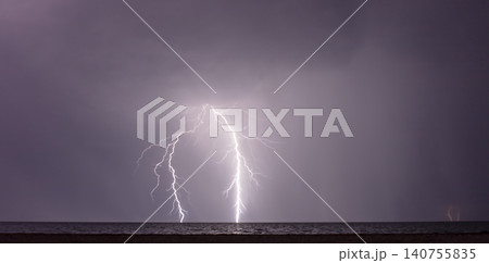 night shooting of a thunderstorm over the sea, photography of lightning night shooting of a thunderstorm over the sea, photography of lightning 140755835