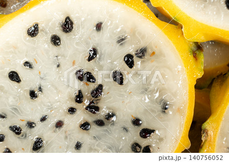 Slices of yellow dragon fruit texture background top view Slices of yellow dragon fruit texture background top view 140756052