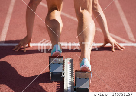 Back view of male feet on starting block ready for a sprint start Back view of male feet on starting block ready for a sprint start 140756157