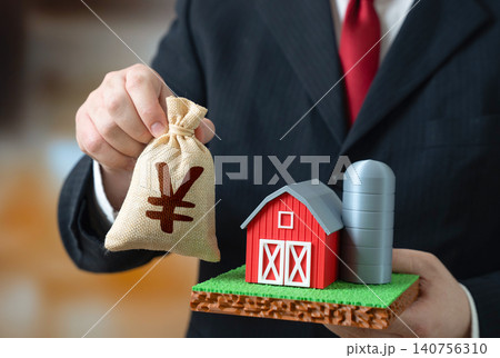 Businessman with a farm and a japanese yen or chinese yuan money bag. Buying and selling a farm. Farmer income, paying taxes. Agricultural assets and rural economy growth. Investing in agribusiness. Businessman with a farm and a japanese yen or chinese yuan money bag. Buying and selling a farm. Farmer income, paying taxes. Agricultural assets and rural economy growth. Investing in agribusiness. 140756310