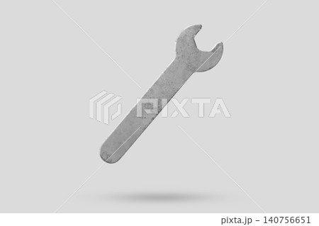 Wrench fly over gray background close up Wrench fly over gray background close up 140756651