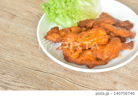roasted spicy barbecue chicken rib with pepper on plate eat couple fresh lettuce vegetable salad roasted spicy barbecue chicken rib with pepper on plate eat couple fresh lettuce vegetable salad 140756740