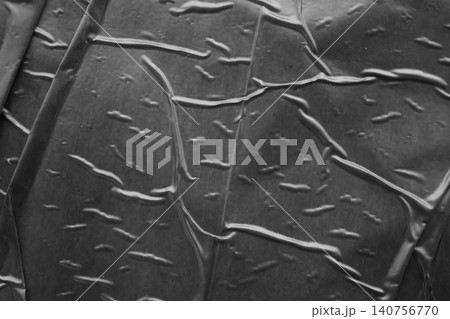 black crumpled and creased plastic poster texture background black crumpled and creased plastic poster texture background 140756770