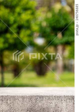 Empty concrete surface with blurred green park background and copy space Empty concrete surface with blurred green park background and copy space 140756885