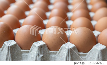 Fresh organic brown chicken eggs in cardboard tray Fresh organic brown chicken eggs in cardboard tray 140756925