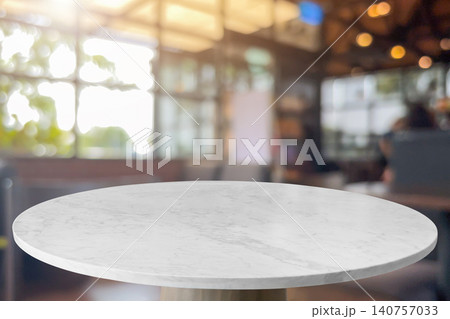 Round marble table top with blurred kitchen cafe restaurant interior background Round marble table top with blurred kitchen cafe restaurant interior background 140757033