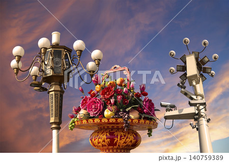 Street lamp and huge flower basket (against the sunset) in Tiananmen square, Beijing, China    140759389