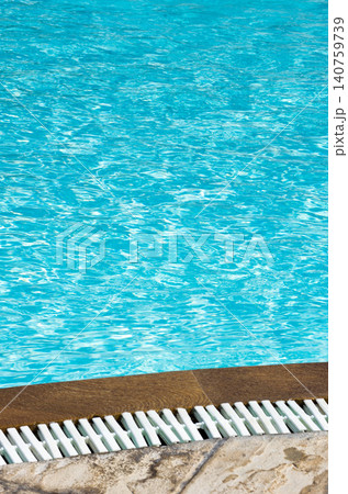 Blue pool water with sun reflections Blue pool water with sun reflections 140759739