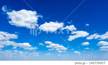 blue sky background with tiny clouds blue sky background with tiny clouds 140759957