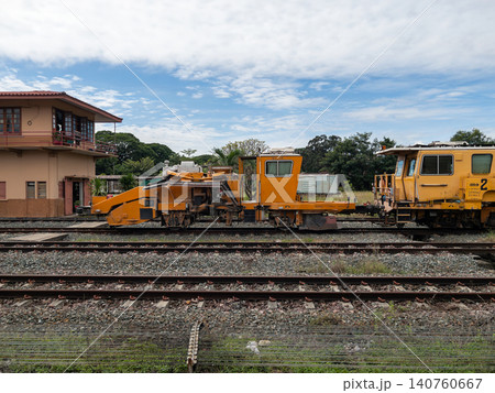 Yellow Railway Ballast Regulator Machine on Thailand Train Track Maintenance Yard Yellow Railway Ballast Regulator Machine on Thailand Train Track Maintenance Yard 140760667