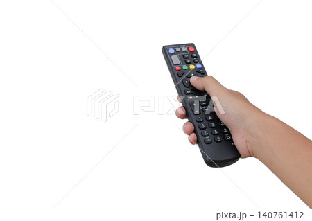 Hand holds remote control against plain white background. Finger presses button, indicating active use. Simple, clean, focused on functionality and ease. Ideal for digital, tech, or media related Hand holds remote control against plain white background. Finger presses button, indicating active use. Simple, clean, focused on functionality and ease. Ideal for digital, tech, or media related 140761412