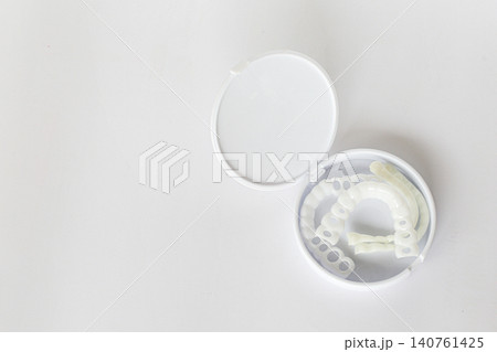 Instant Smile Veneers in a Compact Protective Case on White Background Instant Smile Veneers in a Compact Protective Case on White Background 140761425