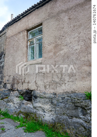 Abandoned house with damaged window Abandoned house with damaged window 140761674